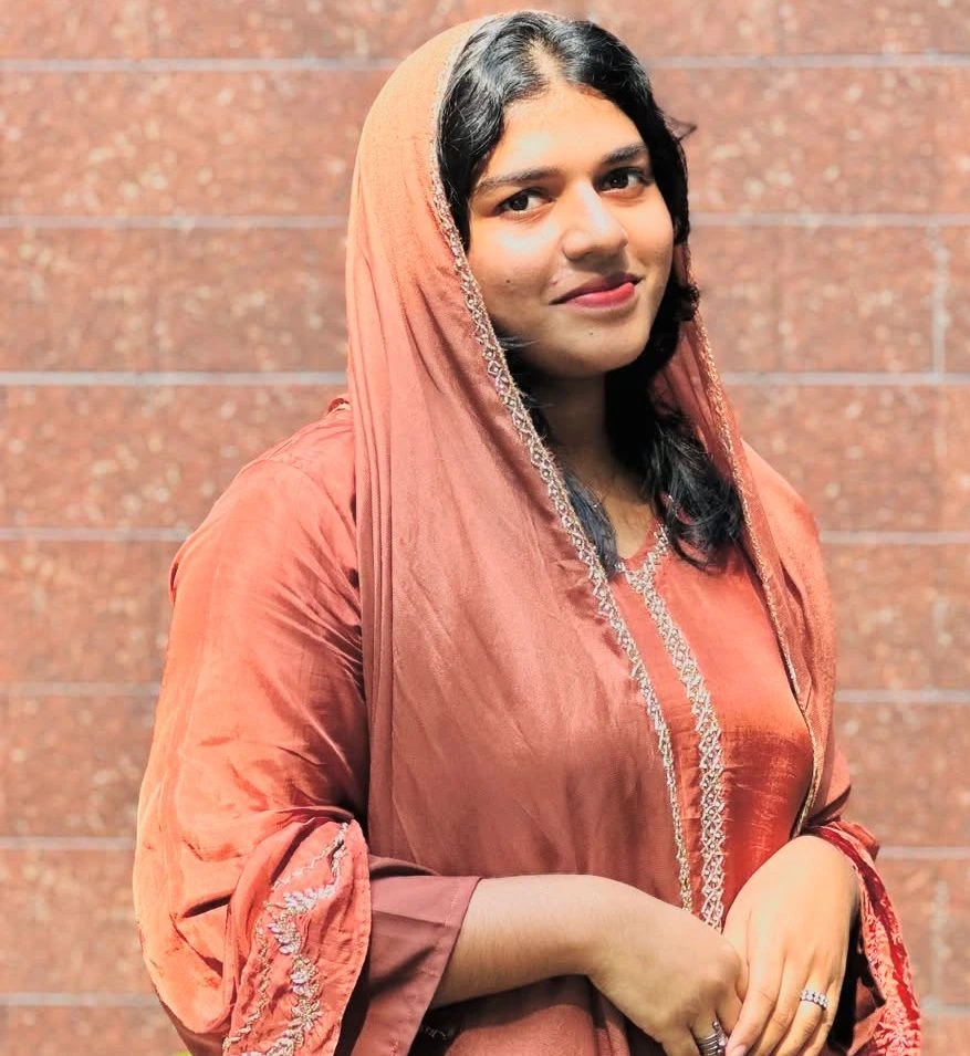 “Smiling woman sharing her positive experience for a mental wellness testimonial.”